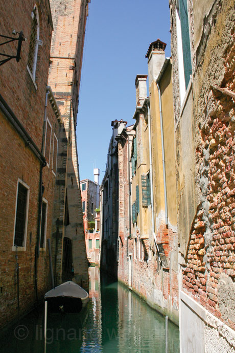 Narrow rio venetian channel photo